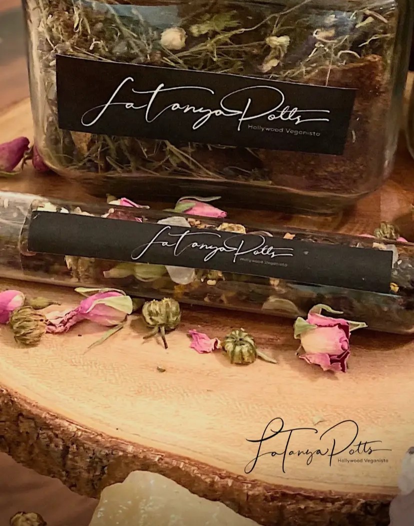 A signature jar of UNBOTHERED loose-leaf tea with rosebuds