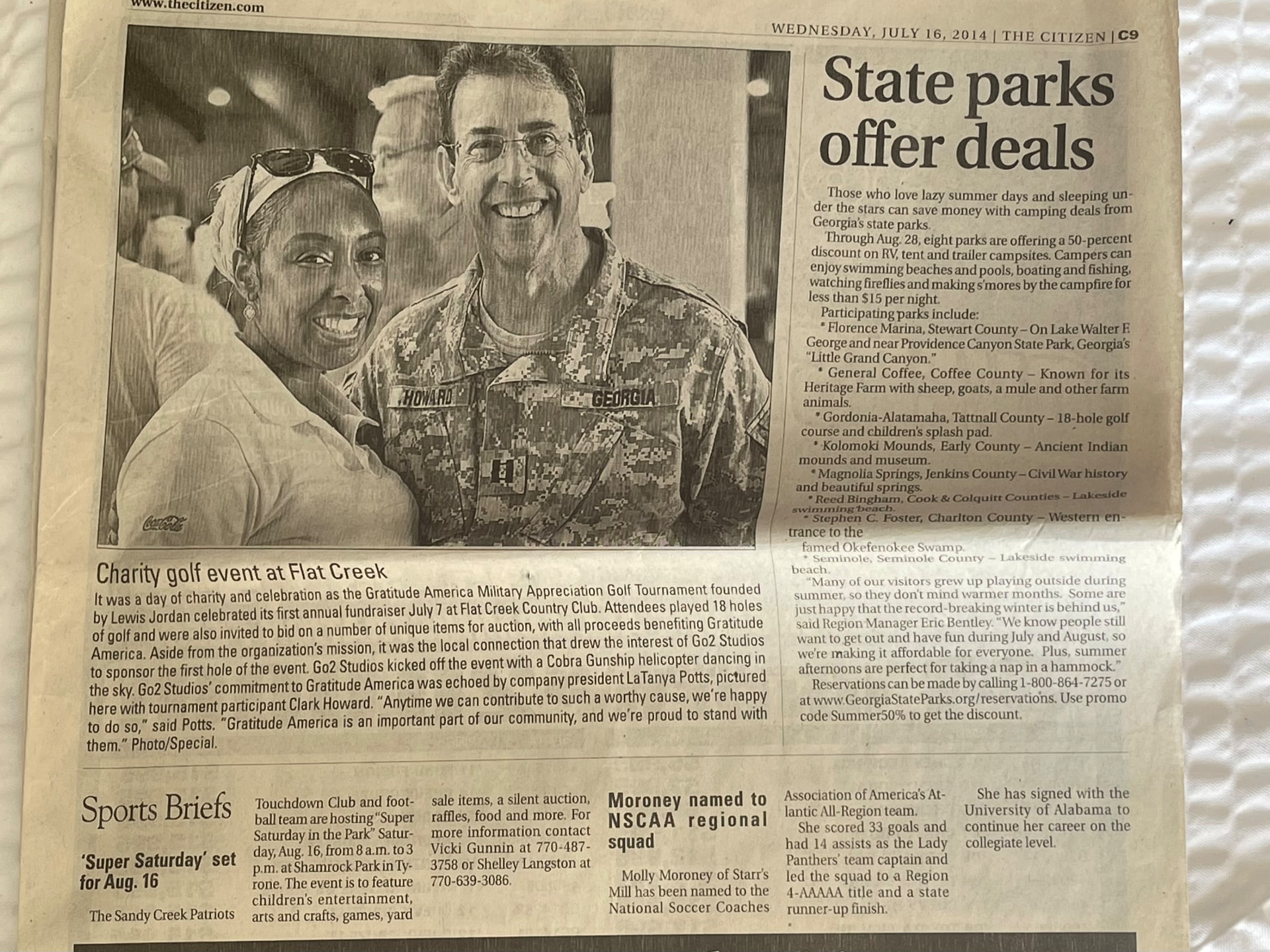 LaTanya Potts with Clark Howard at the Gratitude America Military Appreciation Golf Tournament, The Citizen, July 2014